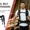 A man wearing a white shirt and dark pants holds a black tool belt with suspenders in a woodworking shop setting.