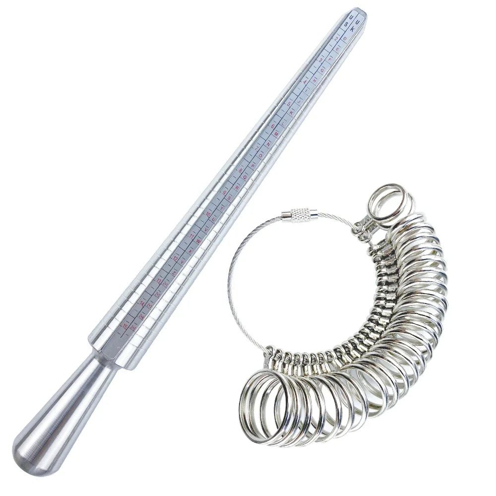 A silver metal ring sizer kit with a ruler and a coiled ring mandrel.