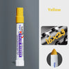 Yellow solid paint marker pen with a yellow cap and white body shown against a gray background.