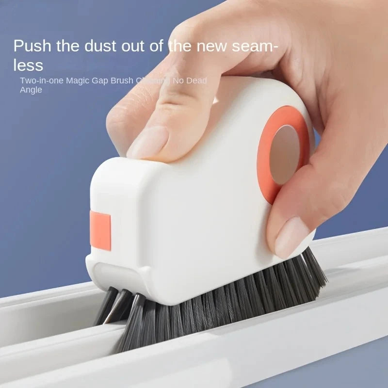 A hand is using a white two-in-one magic gap brush to clean dust from a window track.