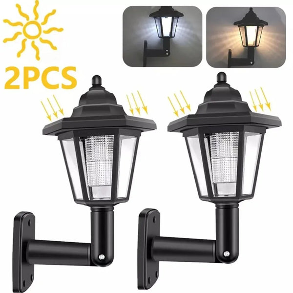 Two black solar outdoor LED garden and street lights with mounting brackets