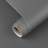 Roll of gray waterproof vinyl wall decals showing the edge and rolled material.