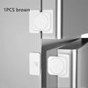 One brown adjustable cabinet and window safety lock with a white circular component.