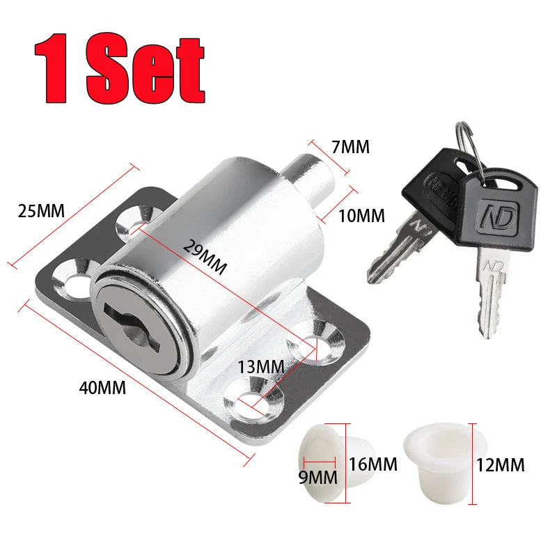 A set of silver sliding door window locks and associated hardware including a latch, key, and mounting plate.