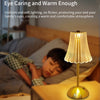 A warm-toned touch sensor desktop reading lamp illuminates a bedside area.