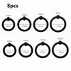Eight silicone rings of varying diameters, ranging from 0.9cm to 3.5cm.