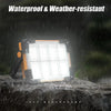 A waterproof and weather-resistant LED flood light is shown shining in the rain on a rock surface.