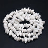 A circular arrangement of small, white natural stone agate beads for DIY jewelry making.
