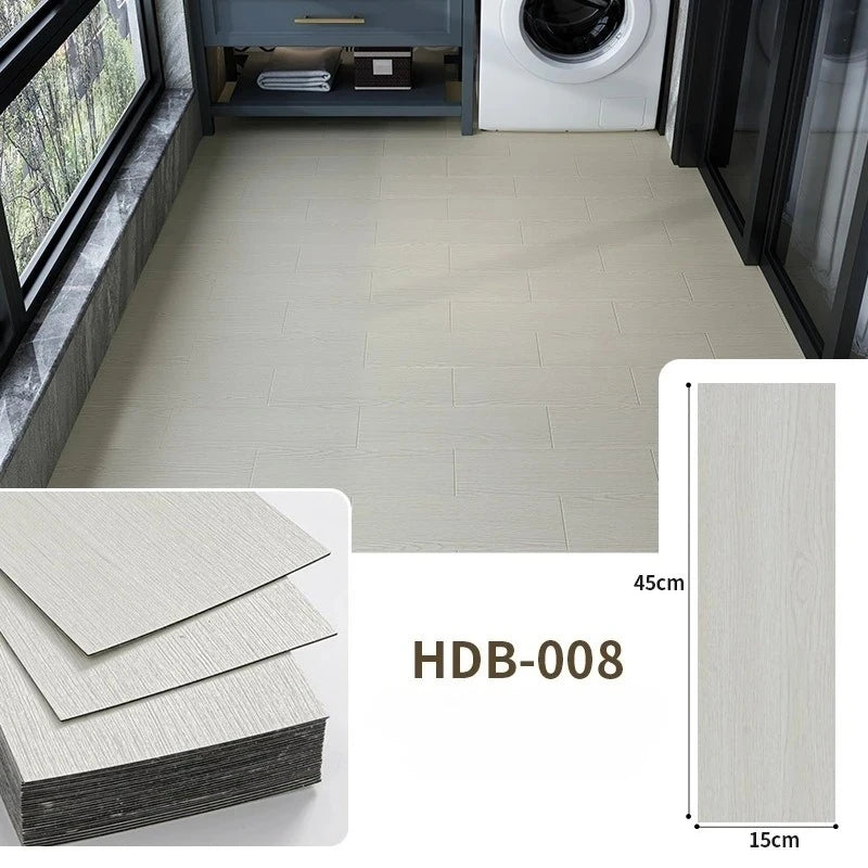 Light wood grain floor tiles installed in a room, showing the tile size and texture.