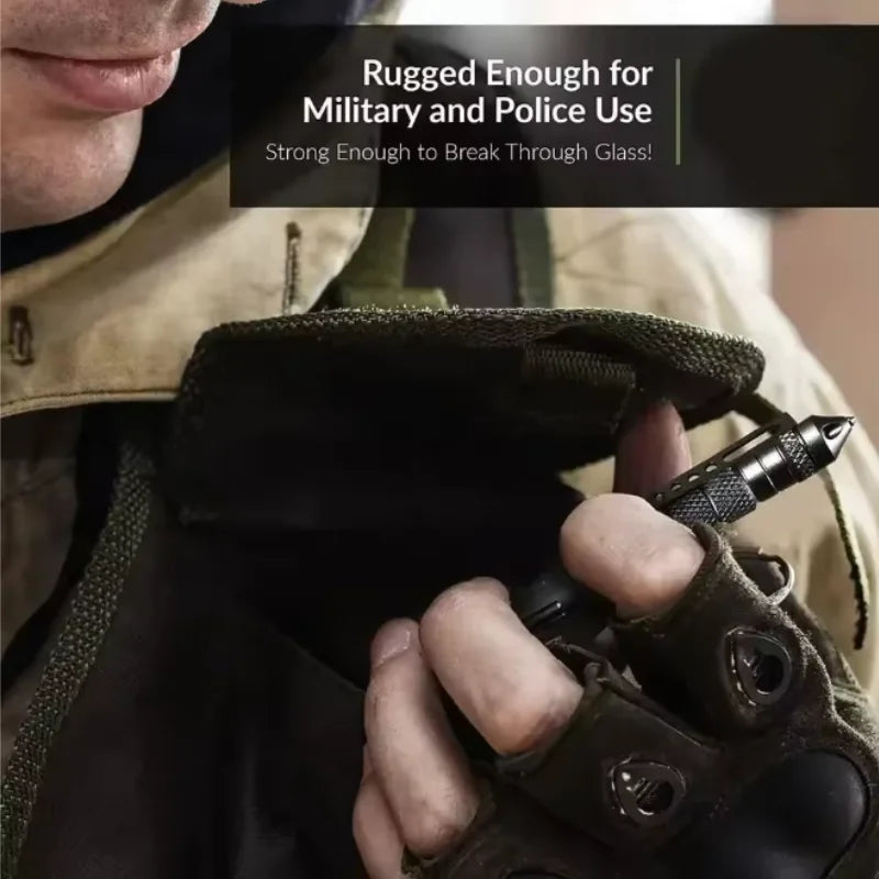 A hand holds a tactical self-defense pen, demonstrating its rugged construction for military and police use.