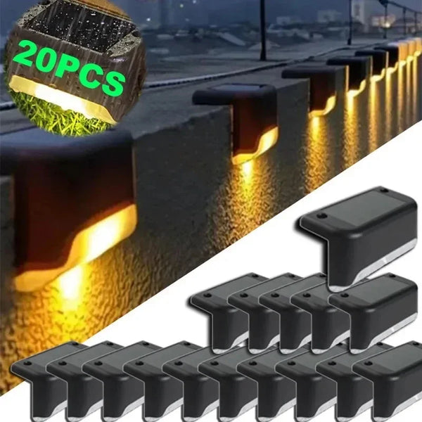 A collection of black solar powered LED step and path lights arranged in a row.