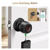 A black smart fingerprint keyless door lock is installed on a white door, with an alert screen visible inside the door.