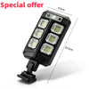 A black solar motion sensor LED outdoor wall light with four illuminated panels.