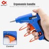 A hand holds a blue hot melt glue gun with an ergonomic handle, demonstrating the control mechanism.