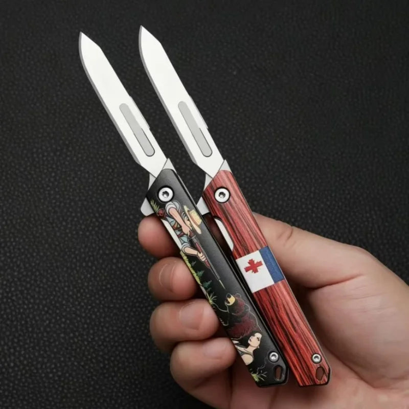 A hand holds a pair of folding utility knives with wooden handles and silver blades against a dark background.