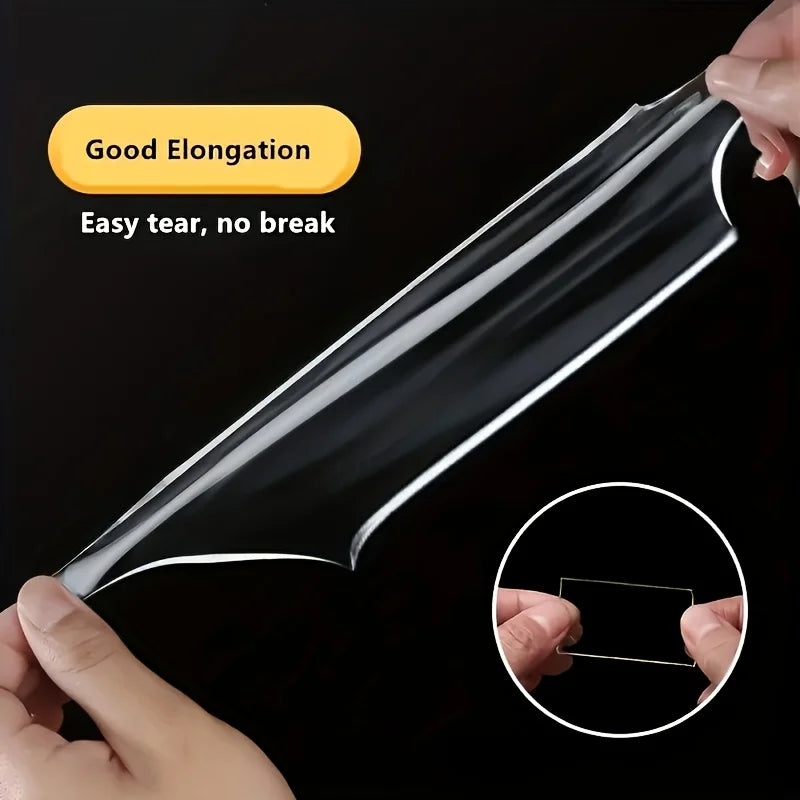 Clear double-sided mounting tape being stretched to show its good elongation and tear resistance
