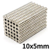 A pile of small, silver refrigerator magnets with a 10x5mm size.