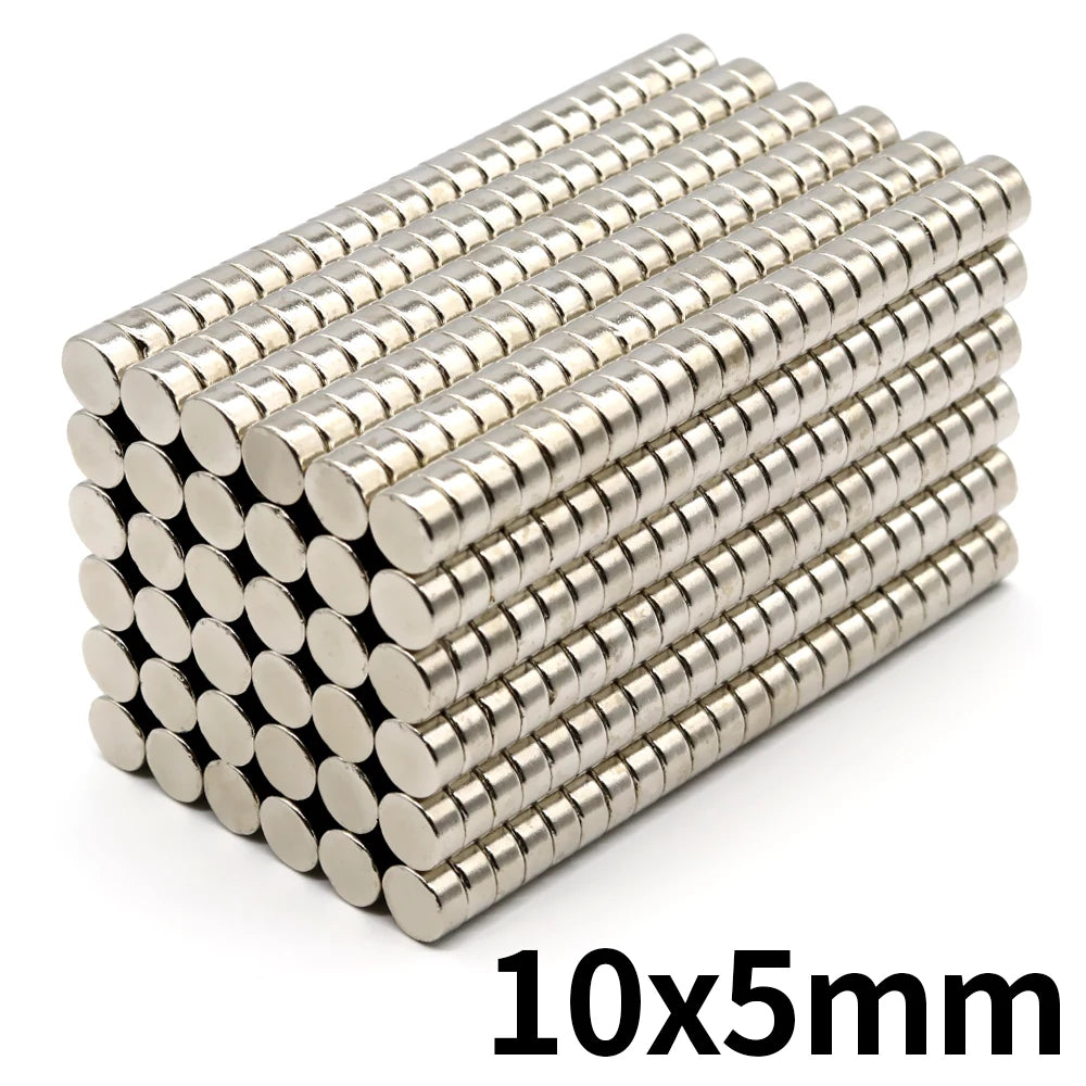 A pile of small, silver refrigerator magnets with a 10x5mm size.