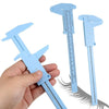 A hand holds a light blue portable mini sliding vernier caliper ruler with a scale and jaws visible.