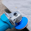 A close-up view of an integrated stone trimming polishing disc set with a blue handle and silver disc on a light surface.