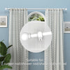 A white iron spliced curtain rod is shown hanging against a light blue wall with sheer patterned curtains.