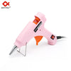 Pink hot melt glue gun with orange accents and a black power cord
