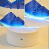 Nahaufnahme einer 3D-Bewegungs-Sandkunst-Sanduhrlampe mit leuchtend blauen Sandmustern.
