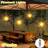 Four packs of bright yellow fireworks lights hanging from a patio umbrella in an outdoor setting.