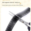 A pair of silver scissors cutting through a black magnetic dual scale flexible measuring ruler.