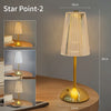 A tall, gold-toned desk lamp with a clear textured shade and a brass base, shown on a wooden surface.