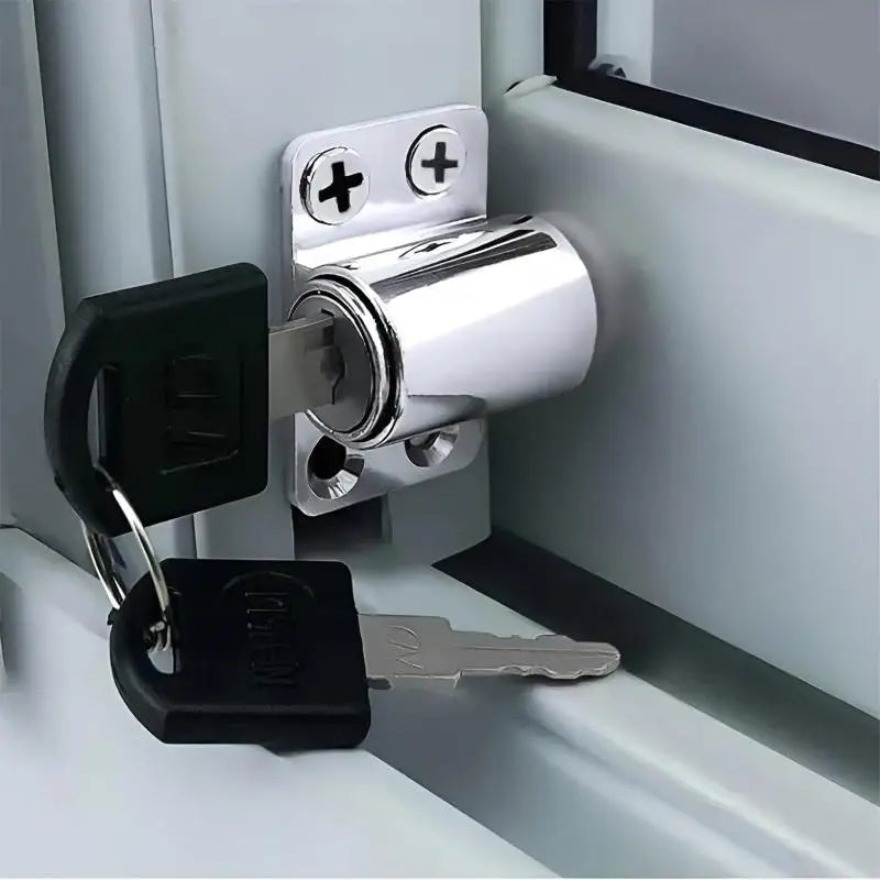 A silver sliding door window lock set with a black padlock and key is shown mounted on a white frame.