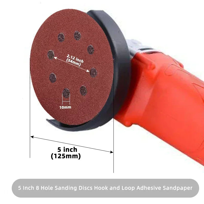 A close-up view of a 5 inch sanding disc with eight holes, used for hook and loop sandpaper on an orbital sander.