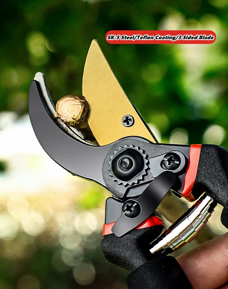 A close-up of a black and gold metal pruning shear with a Teflon coating and a three-sided blade being held by a gloved hand.