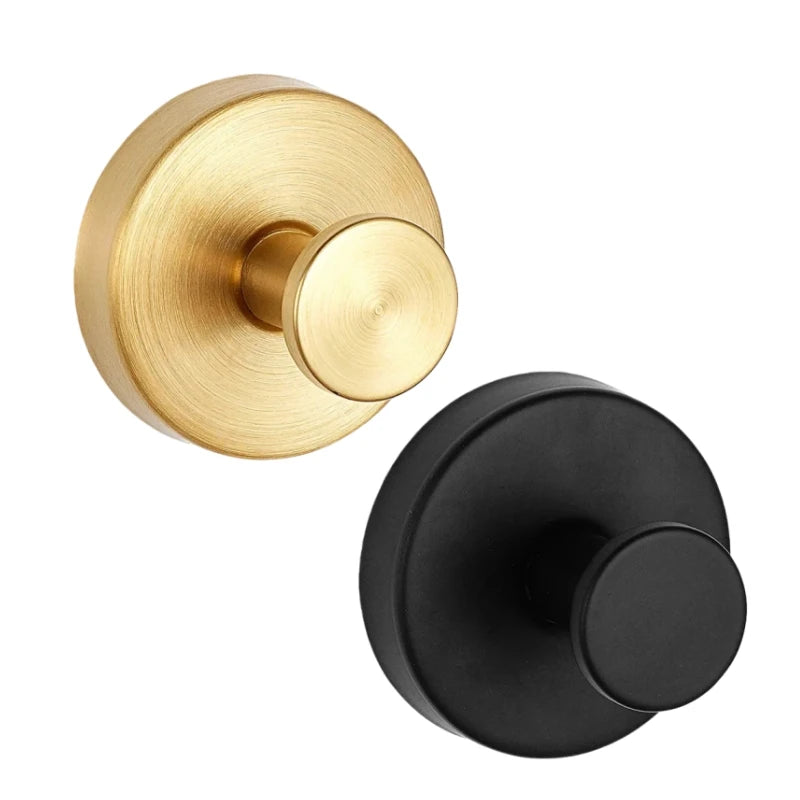 A brass-toned shower hook with a round finish and a black mounting plate.