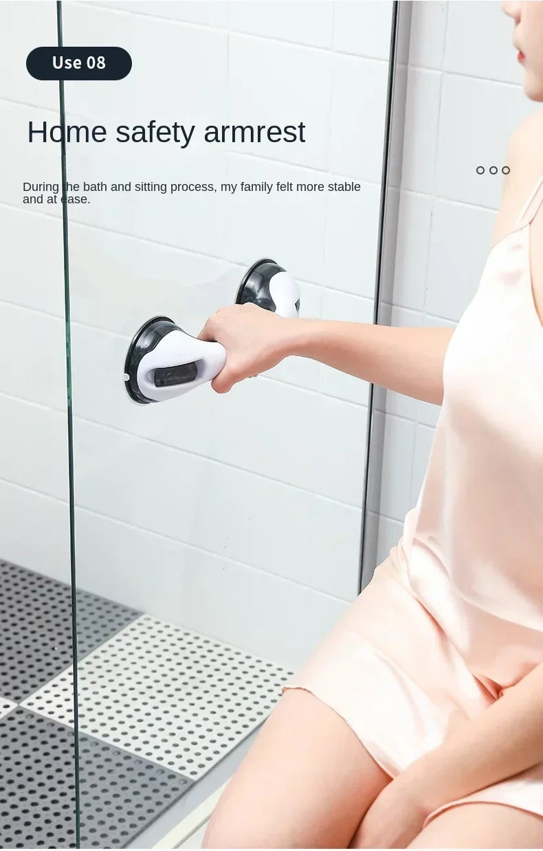 A hand using a home safety armrest on a glass shower door for stability.