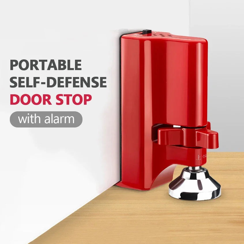 Topes de puerta rojos portátiles con alarma montados en una superficie de madera.