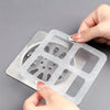A hand holds a reusable mesh strainer for bathroom drains, showing its perforated structure.