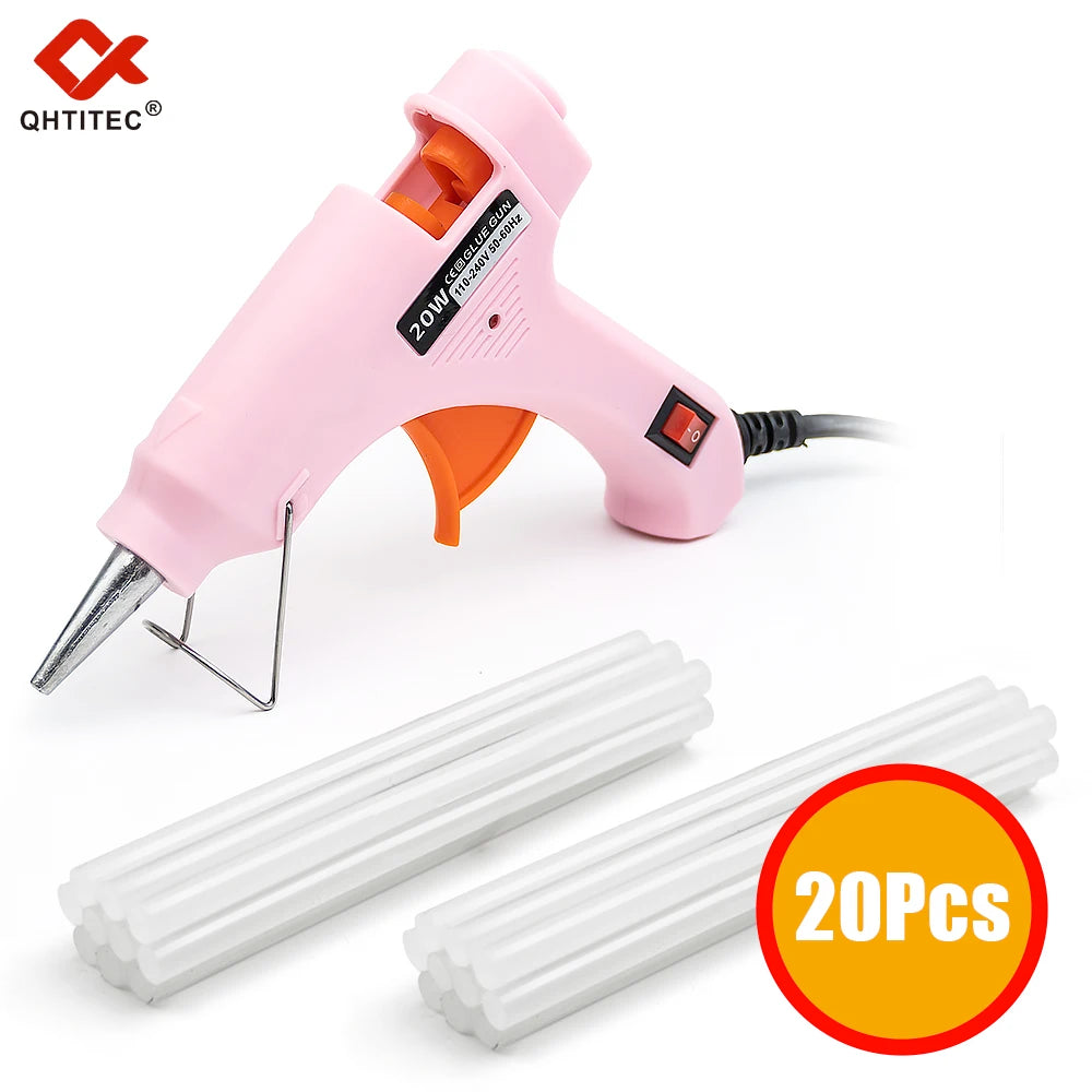 Pink hot melt glue gun and twenty white glue sticks for crafting