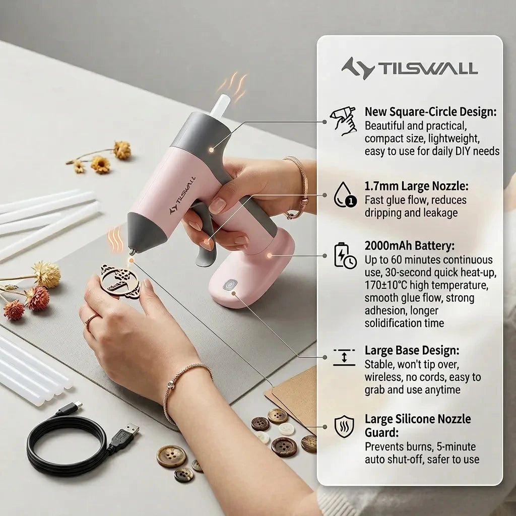 A hand is using a pink cordless hot glue gun to apply glue, demonstrating its features and design.