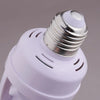 A white PIR motion sensor light bulb adapter with a threaded metal fitting and a plastic housing.