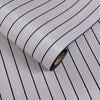 Roll of 3D self-adhesive wall decor grille wallpaper with thin black horizontal lines.