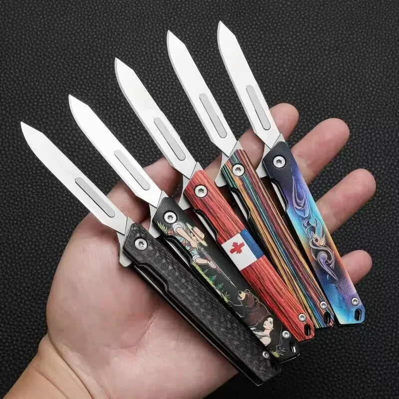 A hand holds five folding utility knives with decorative handles and silver blades.