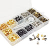 A clear plastic box filled with various precision metal rivets and fasteners for leather and fabric repair