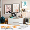 Damage-free hanging and decorating photo frame adhesive strips displayed on a white dresser with framed artwork.
