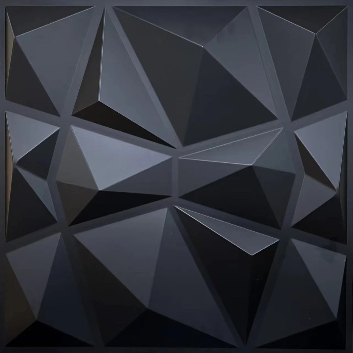 A close-up view of a dark gray, geometric 3D diamond PVC wall panel texture.