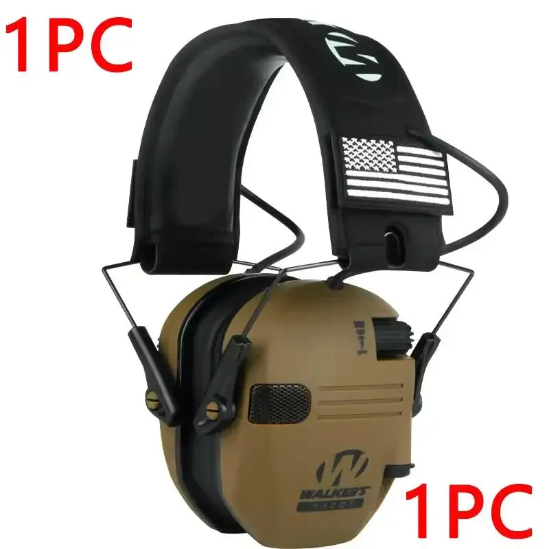 One pair of tan professional noise reduction ear muffs with a black strap and American flag patch.