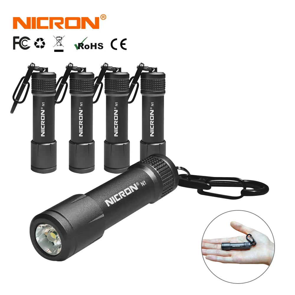 A black Nichron N1 mini key chain LED flashlight with multiple attached flash units.