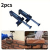 Two black precision wire clips and liners used for construction work