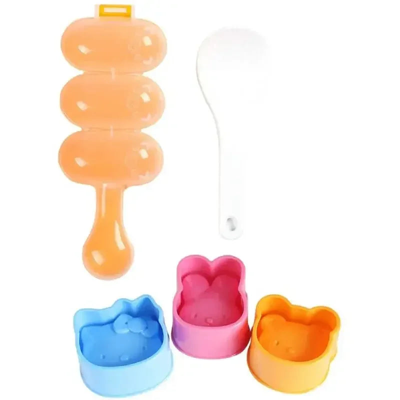 Set aus orange, weißer und pinker Silikon-Reisball-Schüttlern und Formen.