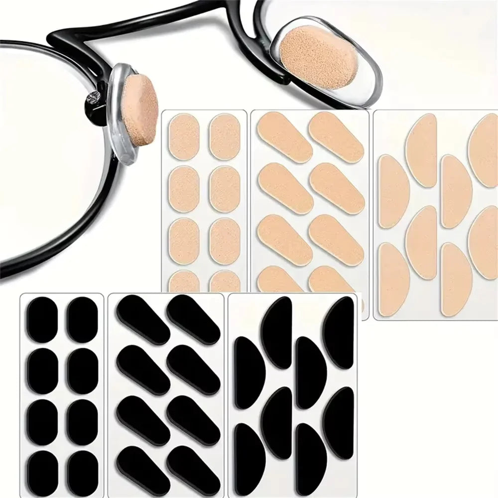 A collection of self-adhesive anti-slip nose pads for eyeglasses in various shades of nude and black.